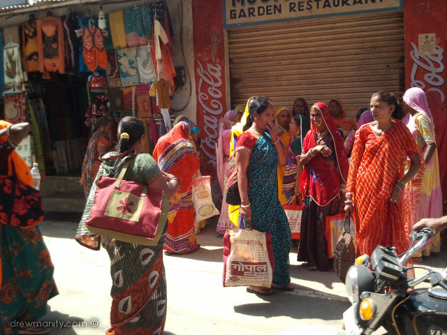 Pilgrm women gather outside a temple