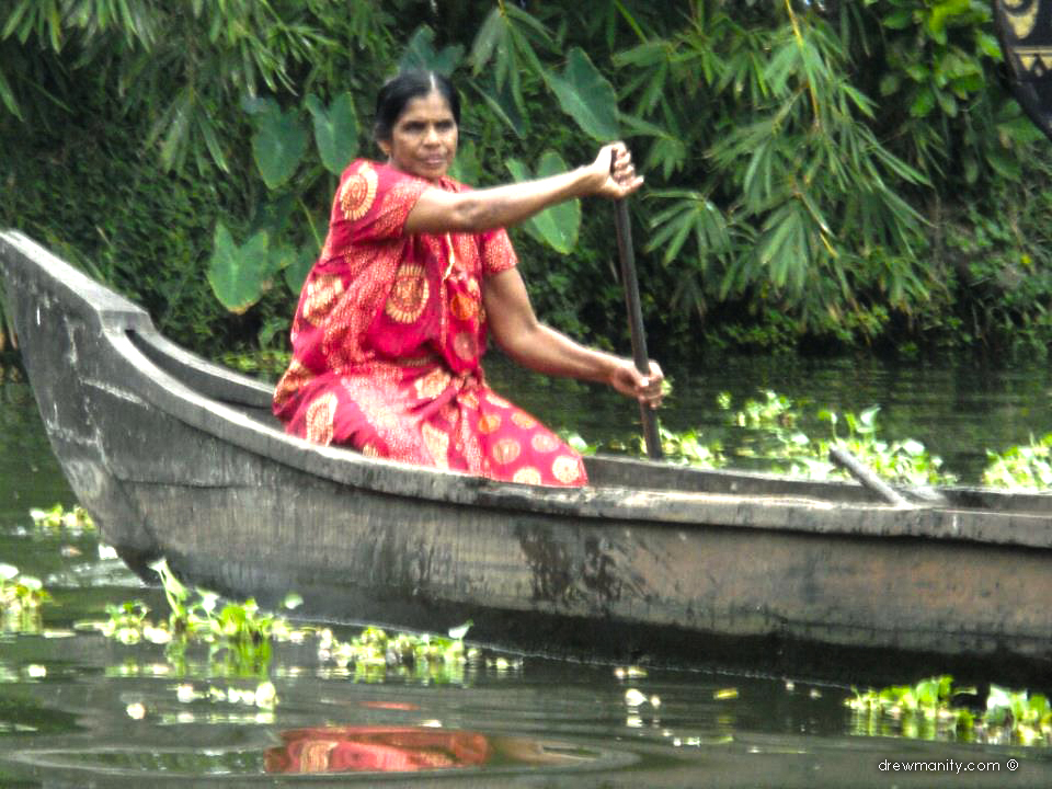 drewmanity.com-india-kerala-backwaters-boat-woman-in-river
